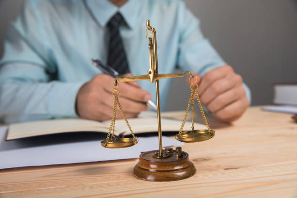 istock scales and the judge writes on papers 1361304007