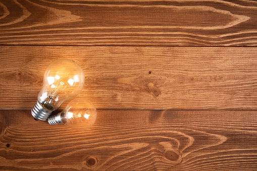 glowing lamp on a wooden table. concept ideas