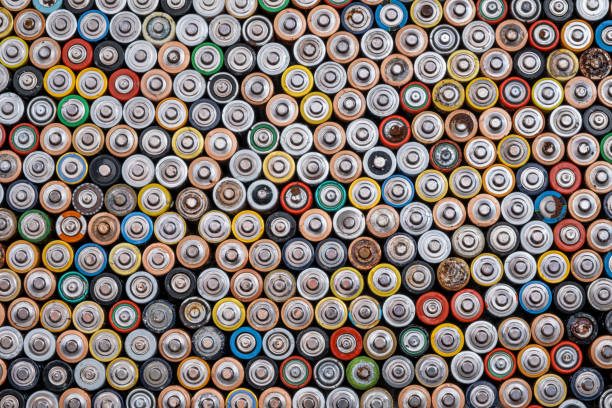 Used batteries from different manufacturers stock photo