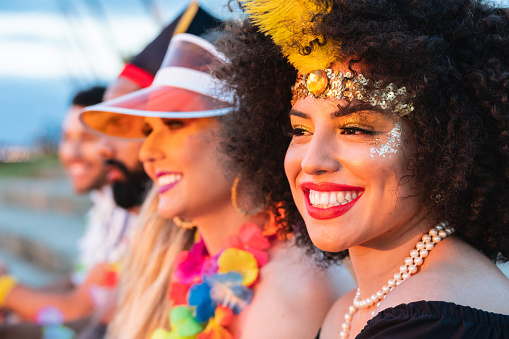 Carnaval in Brasil, portrait of pretty woman watching brazilian party in costume