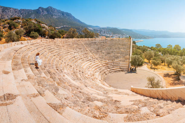 Antiphellos ancient Greek amphitheater as the main tourist attraction in Turkish city of Kas on the Mediterranean coast Antiphellos ancient Greek amphitheater as the main tourist attraction in Turkish city of Kas on the Mediterranean coast greek amphitheater stock pictures, royalty-free photos & images