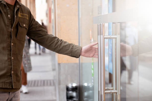 istock opens a glass door on the street 1361312413