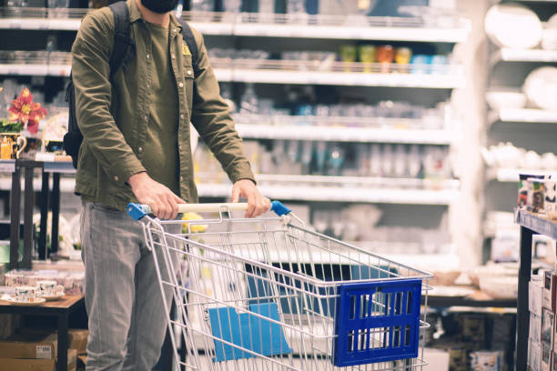 istock standing with a trolley in the store 1361312558
