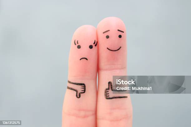 Fingers Art Of Couple Woman Showing Thumb Down And Man Showing Thumb Up Concept Of Disagreement In Family Stock Photo - Download Image Now