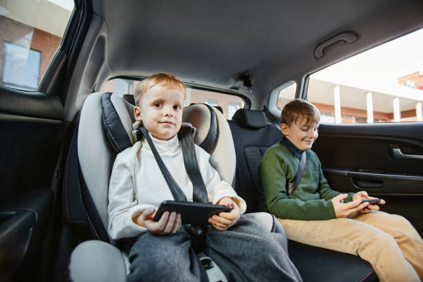 istock Boys in Family Car 1361313744