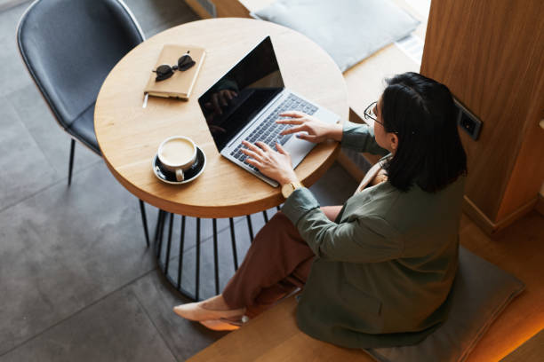 istock Businesswoman Working in Cafe Top View 1361314082