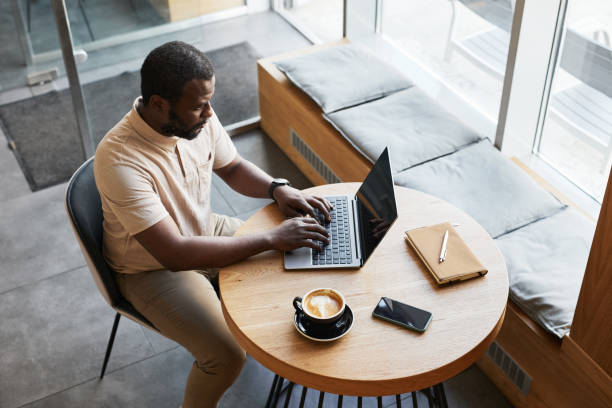 istock Black Businessman Working in Cafe 1361314096