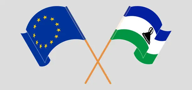 Vector illustration of Crossed and waving flags of the European Union and Kingdom of Lesotho