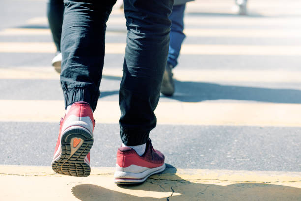 istock people walk on the sidewalk 1361316426