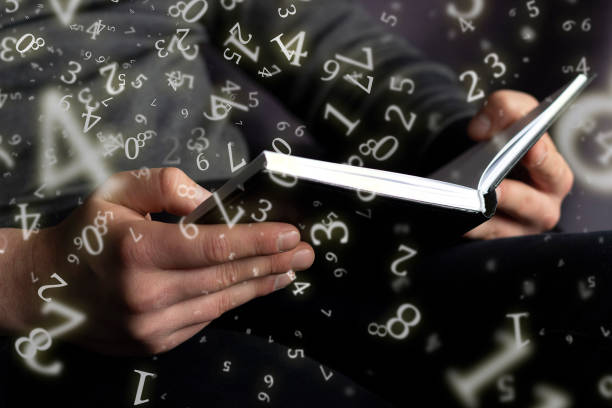 numerology, a man holds an open book in his hands, surrounded by numbers numerology, a man holds an open book in his hands, surrounded by numbers kurma stock pictures, royalty-free photos & images