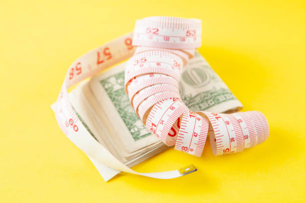 istock money and meter on a yellow background 1361321527