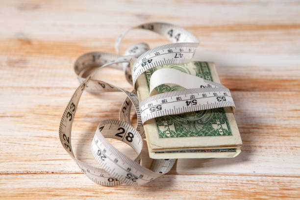 istock money and meter on a yellow background 1361321610