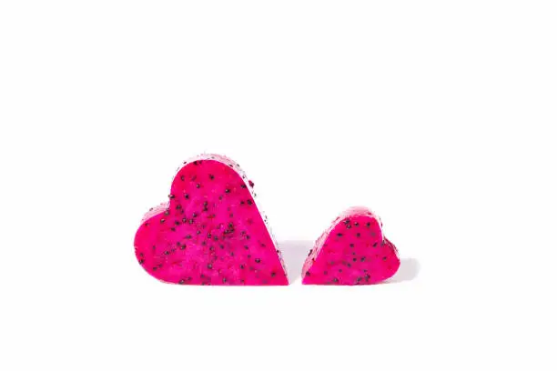 Photo of Pitahaya fruit hearts on white background. Love for this exotic fruit