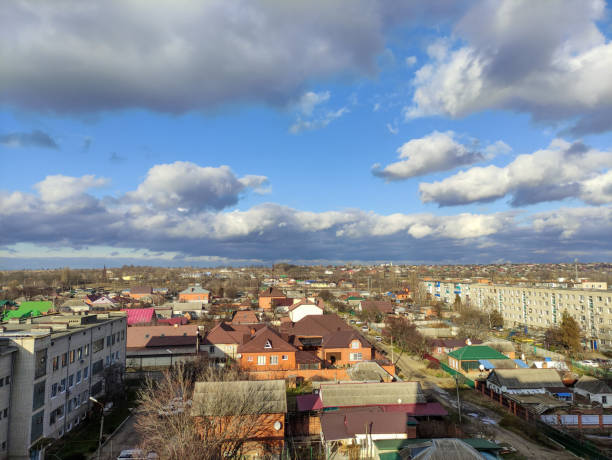 istock Clouds over russian town, autumn or winter cityscape 1361325742