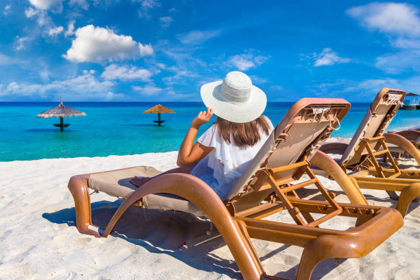 istock Woman lying in sunbed 1361328743