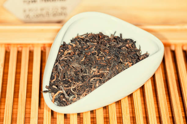 istock Chinese bulk extruded tea ripe Puer in tea presentation vessel 1361332286