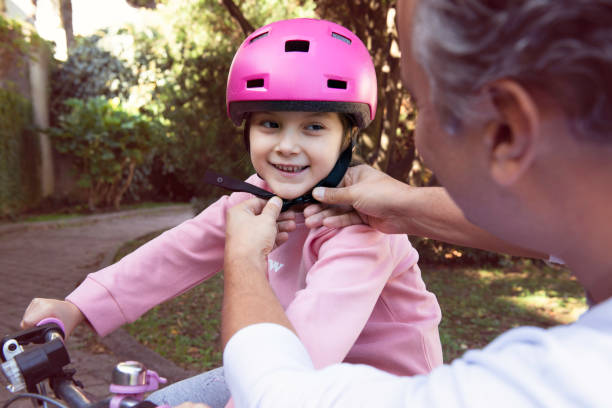 istock Father and Daughter with Bicycle 1361335277