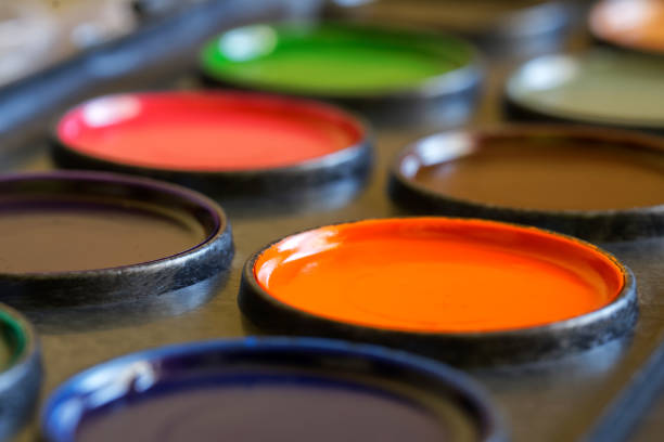 New unused watercolors paints in a box. Macro. Selective focusing. Close-up