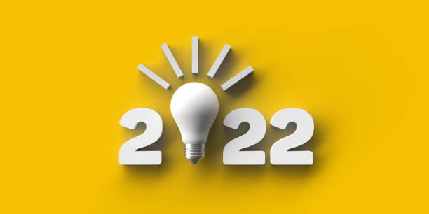 istock 2022 with illuminated bulb on yellow background 1361339614