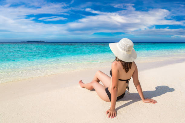 istock Woman at tropical beach 1361344016