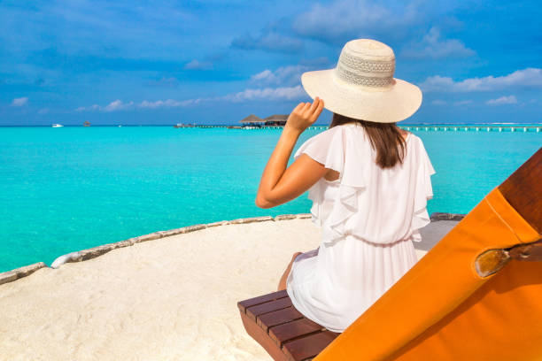 istock Woman lying in sunbed 1361346145