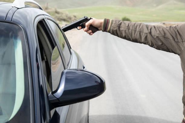 istock threatens the driver with a pistol 1361352539