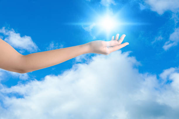 istock Bright light in hand, closeup. Solar energy concept 1361354199