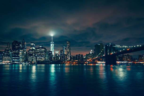 istock View of New York with Brooklyn bridge by night 1361354572