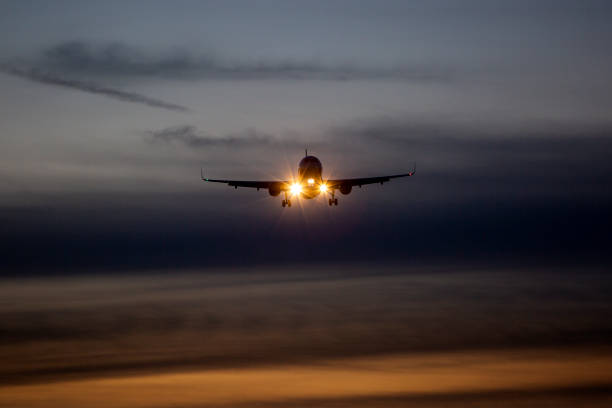 istock Landing airplane at dusk 1361355551