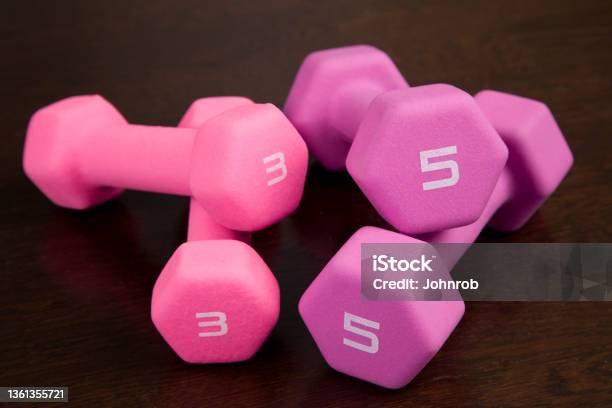 Womens Dumbbells On Wooden Floor Stock Photo - Download Image Now - Activity, Body Building, Close-up