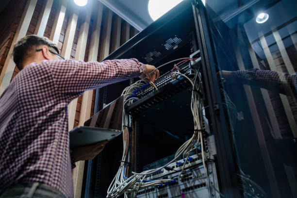 istock Photo with relfections  in the server room a technician/ It engineer/ 1361355728