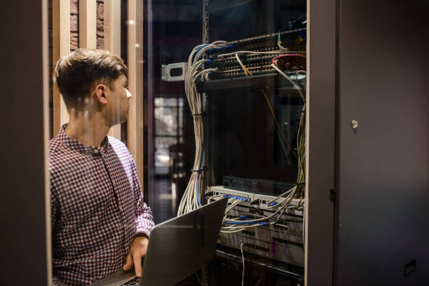 istock Photo with relfections  in the server room a technician/ It engineer/ 1361356981