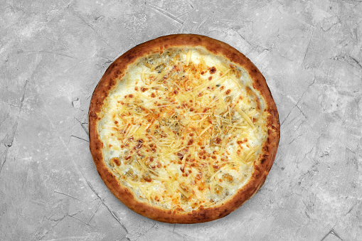 Closeup view of four cheese pizza isolated over white