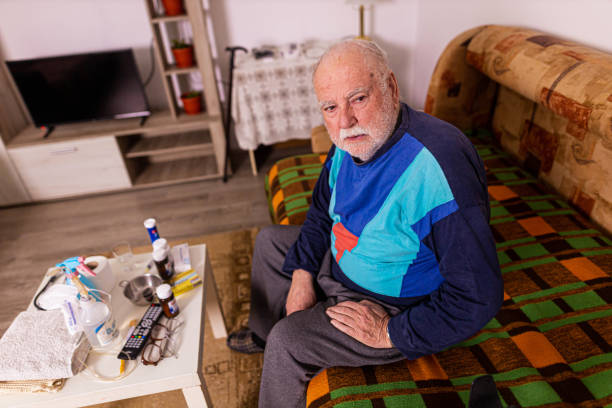 istock Hopeless and physically disabled elderly man, at nursing home 1361357454