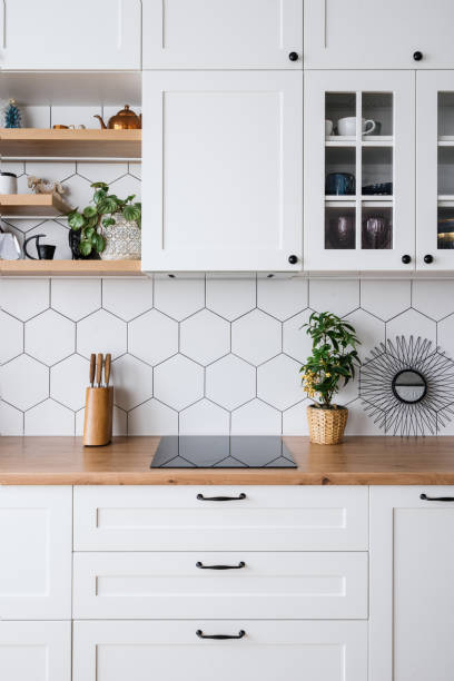 white wood kitchen furniture in modern apartment - stove ceramic burner electricity imagens e fotografias de stock
