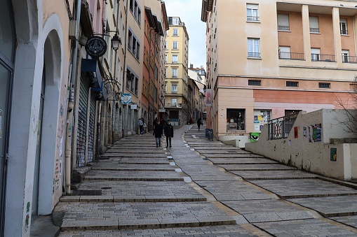 The rise of the big coast, typical sloping street in the Croix Rousse district, city of Lyon, department of Rhône, France