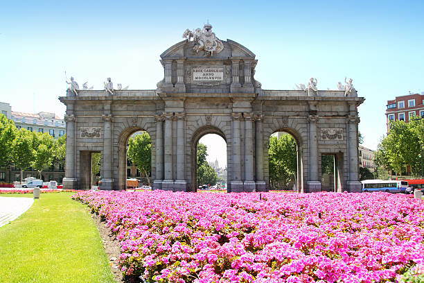 Madrid Puerta de Alcala with flower gardens in Spain