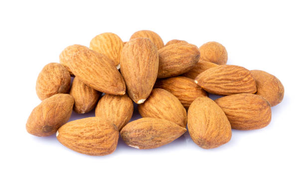 istock Heap of almonds isolated on white background. 1361388592