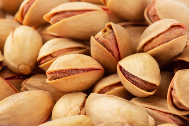 istock Pistachios background closeup macro shot 1361388639