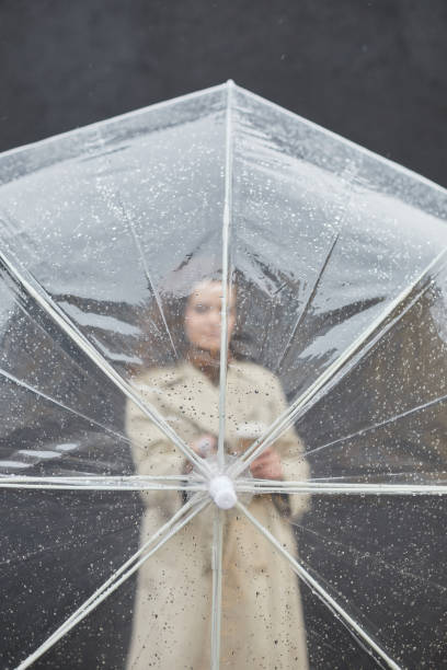 istock Modern Woman With Umbrella 1361389702