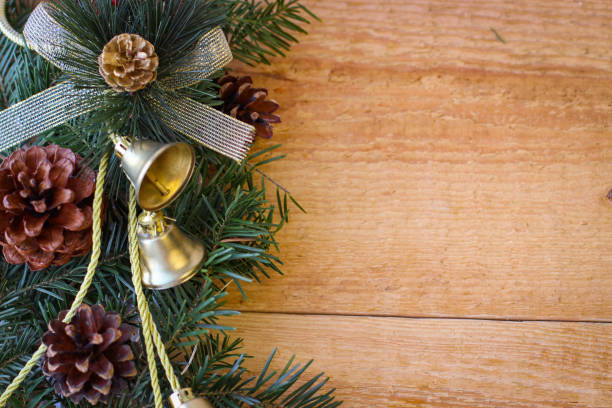 istock Christmas background. Spruce branches with cones and bells 1361390054