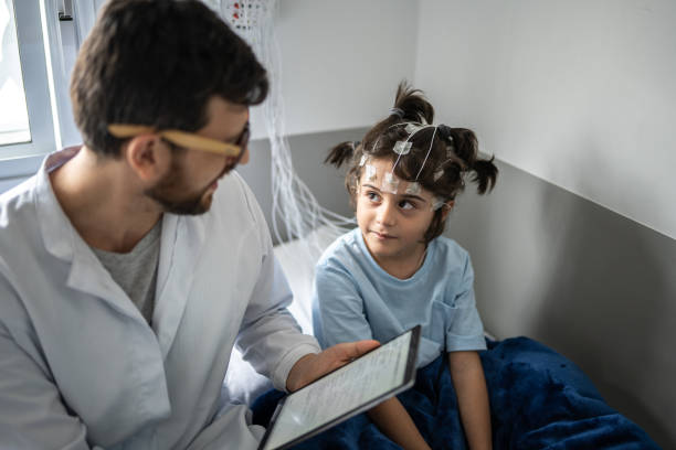 istock Doctor talking to a boy before polysomnography (sleep study) 1361393963