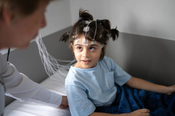 istock Doctor talking to a boy before polysomnography (sleep study) 1361393986