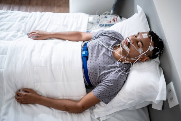 Patient sleeping in a medical clinic doing polysomnography (sleep study)