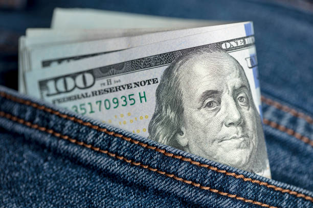 istock Dollar bills in jeans pocket 1361395429