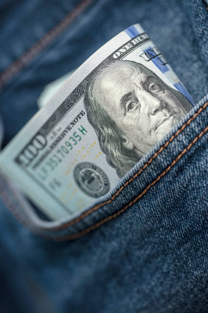 istock Dollar bills in jeans pocket 1361395994