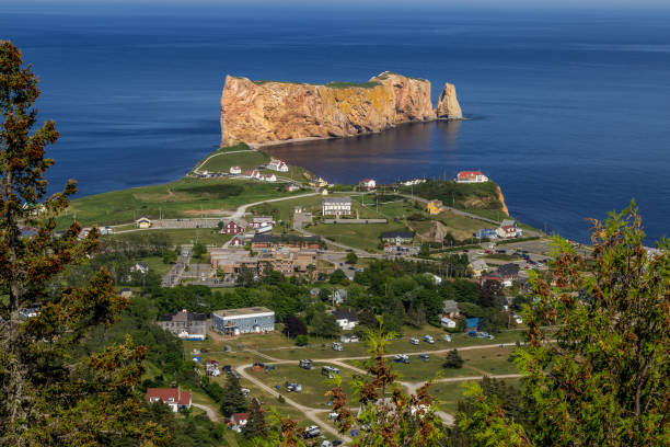 A look at the small town of Percé and its famous Rocher Percé (Perce Rock), part of Gaspe peninsula in Québec. A look at the small town of Percé and its famous Rocher Percé (Perce Rock), part of Gaspe peninsula in Québec. gulf of st lawrence photos stock pictures, royalty-free photos & images
