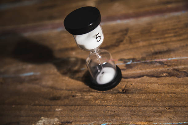istock hourglass on a wooden table 1361398623