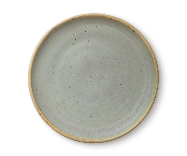 Pottery Plate Rustic green pottery plate earthenware stock pictures, royalty-free photos & images