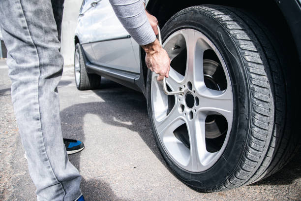 istock changes the wheel of the car 1361401422